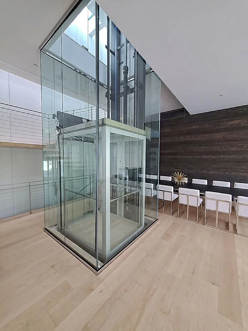 RMEP full-height glass cab in an open atrium